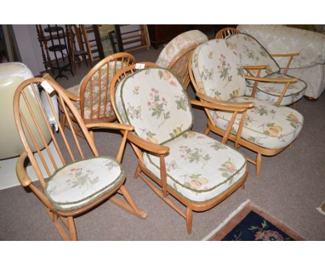 Three Ercol covered seat open arm easy chairs with loose seat and back cushions; and a rocking chair in similar style with lo
