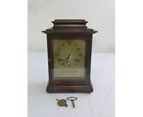 A mahogany cased mantle clock with Jerome movement, silvered dial, Roman numerals, to include key and pendulum