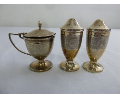 A silver three piece engine turned condiment set, Birmingham 1936