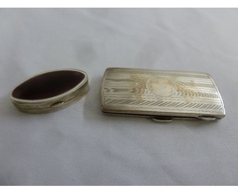 A silver and enamel pill box and a silver engine turned silver cigarette case