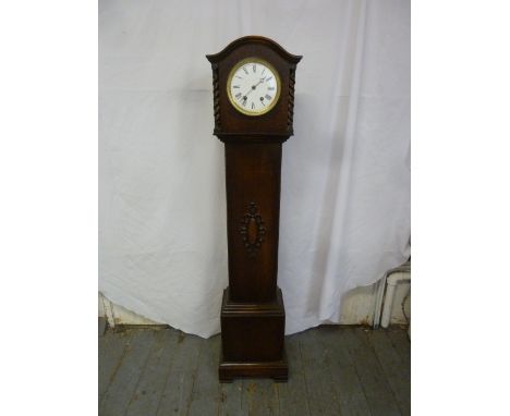 An oak cased grandmother clock, two train movement, enamel dial, Roman numerals, to include key and pendulum