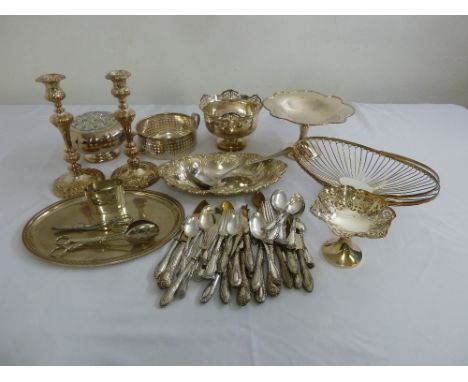 A quantity of silver plate to include candlesticks, dishes, a tray, a rose holder and flatware