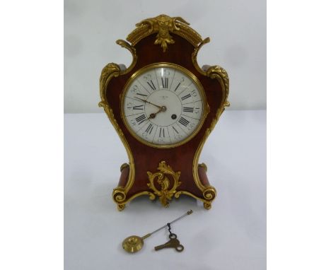 Edwards of Glasgow tortoiseshell and gilded metal mantle clock in the French style with white enamel dial, Roman numerals, tw