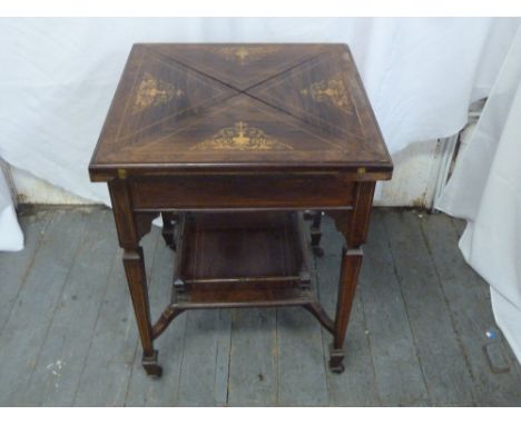 An Edwardian inlaid envelope card table of rectangular form on tapering rectangular legs with original castors