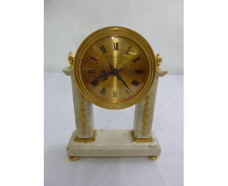 Boucherer a white marble and gilt mantle clock on rectangular marble base