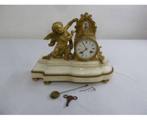 A French marble and ormolu mantle clock, flanked by a putti with white enamel dial, Roman numerals, to include key and pendul