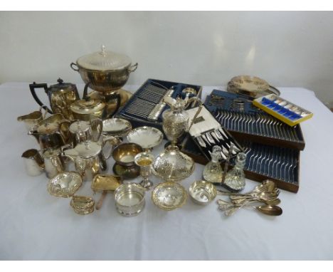 A quantity of silver plate to include flatware, a soup tureen and cover and a coffee pot