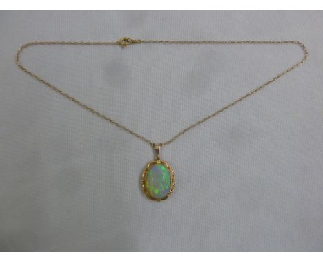 15ct rose gold pendant set with an opal on an integrated chain