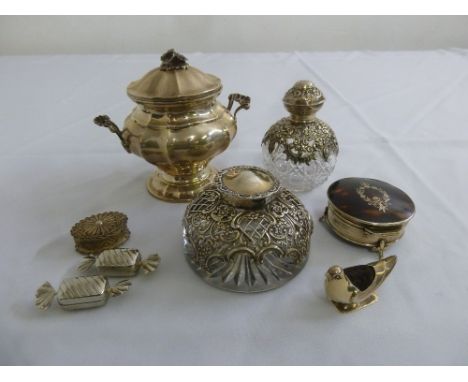 A quantity of silver and white metal to include a covered dish, two dressing table bottles with silver mounts, a pin cushion,