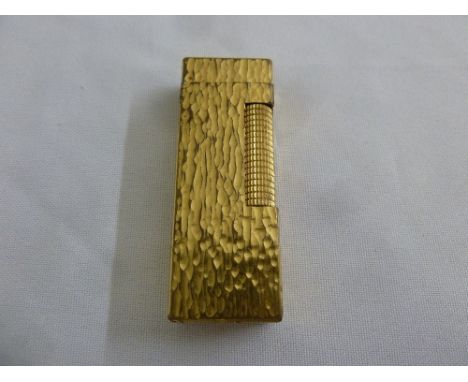 A Dunhill bark finish cigarette lighter