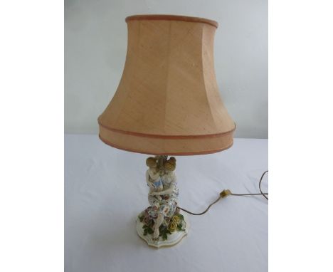 A Continental porcelain figural group of a mother and child table lamp, to include silk shade