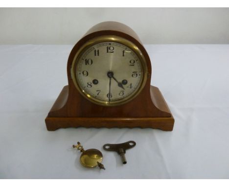 An early 20th century mantle clock Arabic numerals, silvered dial to include key and pendulum