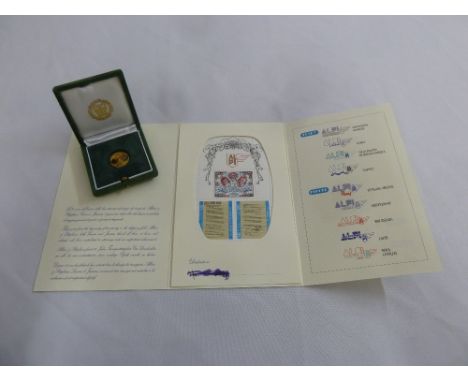 A limited edition 50th Anniversary coin in fitted case and accompanying first day cover