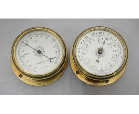 An aneroid barometer and similar thermometer by GEC, each with circular silvered dial and circular brass case, 12cm diam
