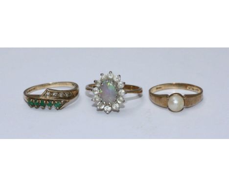 Three various 9ct gold rings including one centrally set with an opal and another with a single pearl etc. Gross weight of ri