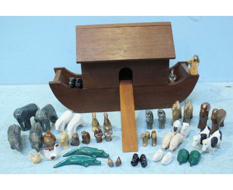 A mahogany Continental Noah's Ark with Noah, Naamah and twenty one pairs of ceramic animals