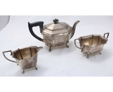 A three piece silver tea set by 'Cheltenham and Co.' including a teapot, sugar pot and a jug etc. Gross weight approximately 