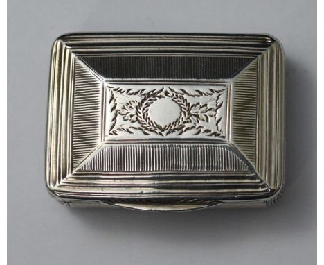 A George III silver and silver-gilt rectangular patch box, with foliate-engraved and reeded decoration to the bevelled hinged
