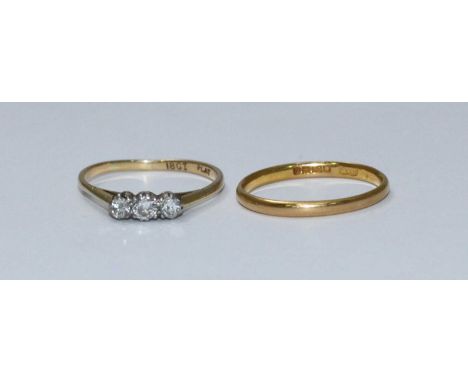 An 18ct gold three stone diamond ring, total diamond weight approximately 0.33cts, gross weight of ring approximately 1.9g, t