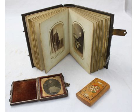 A 19th century burr wood rectangular snuff box with geometric painted hinged cover, together with a small Victorian embossed 