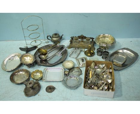 A good quantity of silver-plated wares including trays, a cake stand, candlesticks and a teapot etc. together with a large qu