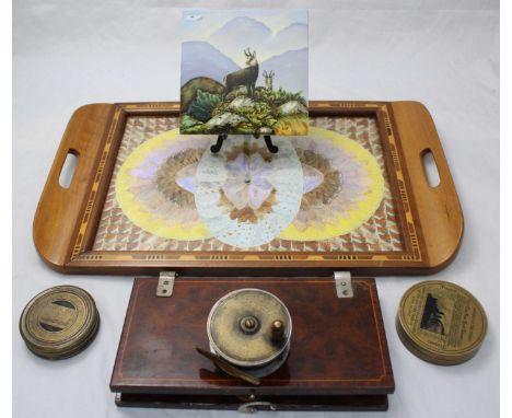A brass cased compass engraved 'Sinking of the Titanic', together with another engraved 'Liburnia' compass, a fishing reel, A