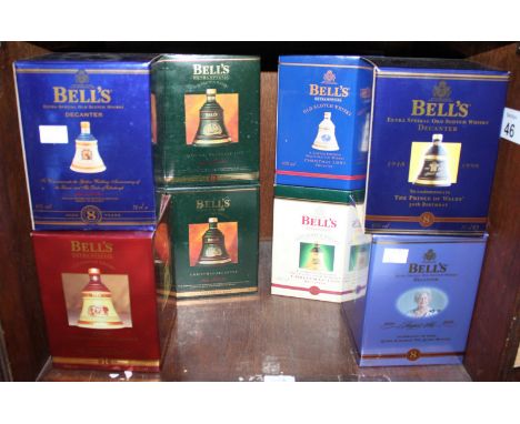Eight boxed ceramic bottles of Bell's Extra Special Old Scotch Whisky, Christmas editions and Royal Commemorative, each 70cl 