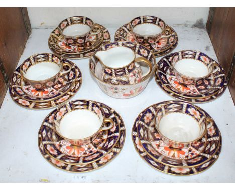 SECTION 28. A Royal Crown Derby porcelain tea set with 'Japan' cigar bands, comprising six-each cups and saucers, side plates