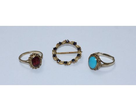 A 9ct gold ring with cabochon turquoise stone, together with a 9ct gold ring set with probably a garnet and a 9ct gold circul