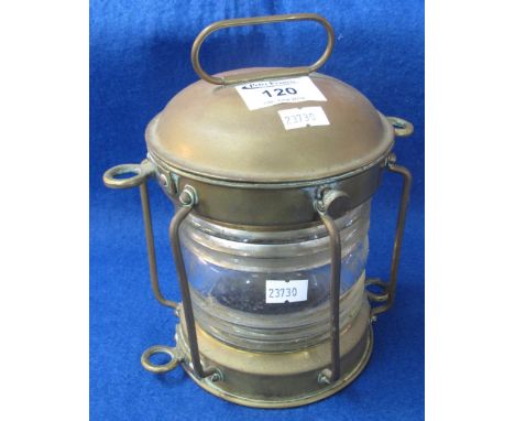 Small brass ship's type lantern of cylindrical form with ribbed clear glass lens, 19cm high.(B.P. 24% incl. VAT)