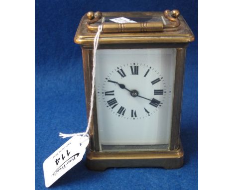 Early 20th Century French brass carriage clock with full depth Roman enamel face, 12cm approx. high.(B.P. 24% incl. VAT)