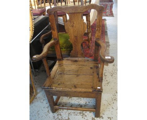 18th/19th Century oak and elm primitive splat back elbow chair with lift seat (originally a commode).(B.P. 24% incl. VAT)