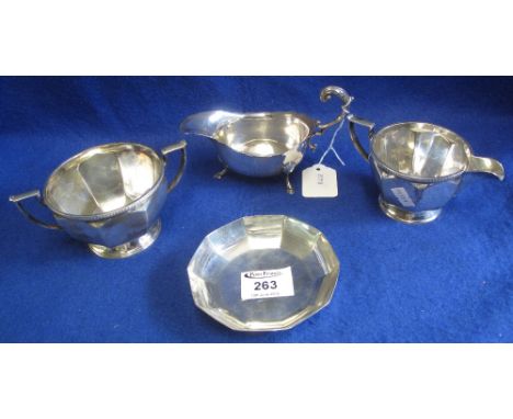 Group of silver and plated items to include: silver card cut sauce boat with Chester hallmark; silver faceted circular dish w