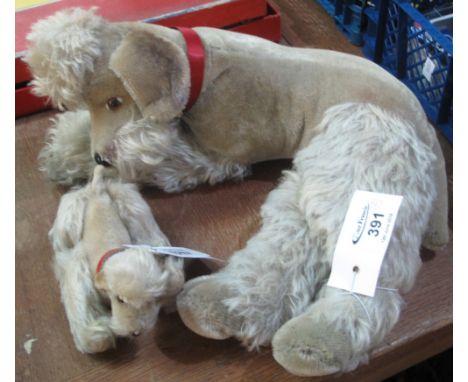 Vintage Steiff recumbent poodle with silver button, together with another smaller Steiff poodle with articulated legs and sil