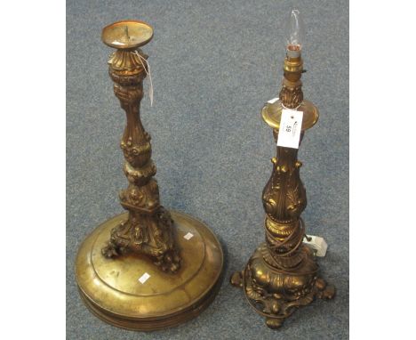 Heavy brass and copper rococo style candle stand together with a bronzed metal table lamp. (2)(B.P. 24% incl. VAT)