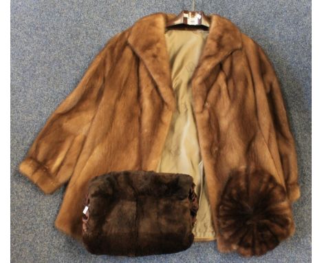 Vintage light brown mink fur jacket, lining marked with crowns with the word 'sovereign' underneath, together with a dark bro