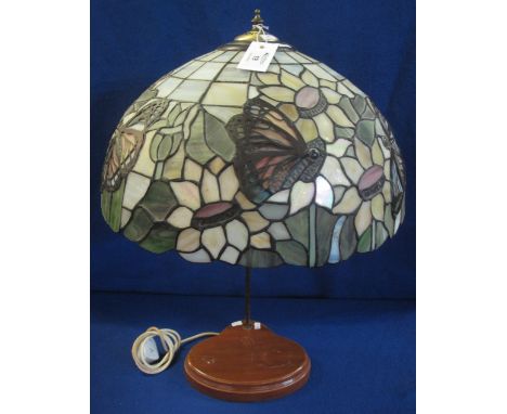 Tiffany style table lamp with wooden base and large butterfly decorated shade.  64cm high.(B.P. 24% incl. VAT)