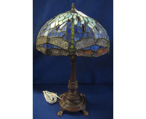 Large Tiffany style table lamp having bronzed finish, baluster shaped base with a coloured dragonfly design shade.  70cm high