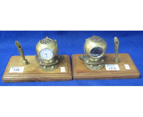 Two similar brass desk stands in the form of vintage divers helmets, having clock faces and pen holders on wooden bases. (2) 