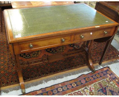 Reproduction yew wood sofa type table with leather inset top.(B.P. 24% incl. VAT)