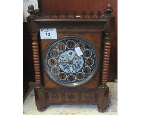 Late Victorian aesthetic design mantel clock with painted face, flanked by bobbin turned pillars, brass drum movement.  29cm 