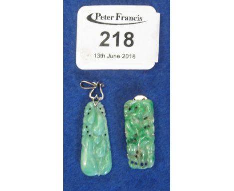 Carved jade pendant with silver mount together with a carved jade dress clip. (B.P. 24% incl. VAT) CONDITION REPORT: Jade dre