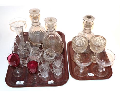 Antique glass comprising a pair of Georgian decanters and a single decanter with stoppers, an engraved vase, eight various gl