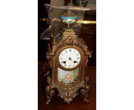 A gilt metal porcelain mounted striking mantel clock, circa 1890