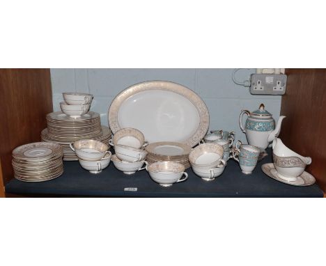 Royal Doulton Gold Sovereign dinner service comprising an oval dish, sauceboat with stand, twelve dinner plates, twelve desse