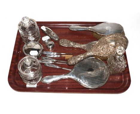 A silver trinket box, HM, Birmingham, 1918; with two hand mirrors, two brushes, a mounted scent bottle and various manicure i
