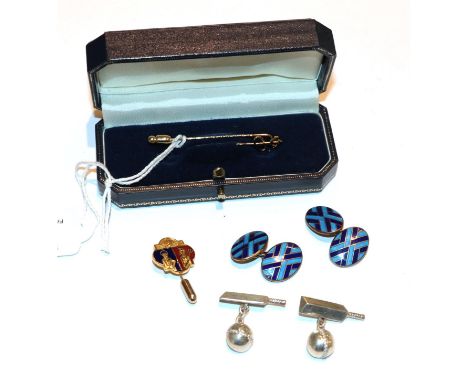 A 9 carat gold Saints &amp; Sinners stick pin, boxed; a 9 carat gold enamel lapel pin; a pair of silver enamel cufflinks; and