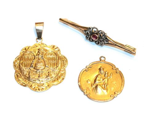 A religious pendant, indistinctly marked, length 2.1cm; a pendant stamped '18KT', length 4.2cm; and a ruby and diamond bar br