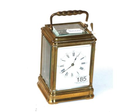 A French brass carriage clock, enamel Roman and Arabic dial, with key, movement back plate stamped H J for Henri Jacot, Made 