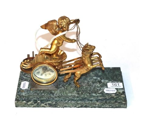 A 19th century French gilt-metal mantle clock, in the form of a chariot with green marble base (converted to electric) 